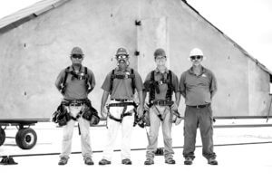 Mid-South Roof Systems Team Members atop a roof
