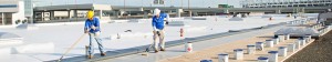 Mid-South Roof Systems Team Members atop a roof working on commercial re-roofing