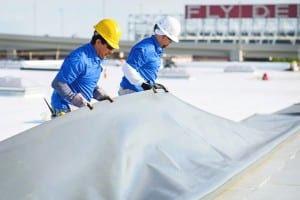 Mid-South Roof Systems Team Members atop a roof working using Commercial Roof Materials