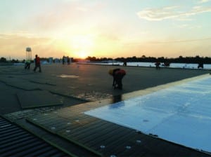 Mid-South Roof-Systems team members Protect Roof from UV light