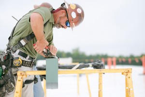 Mid-South Roof Systems sheet metal worker atop roof working