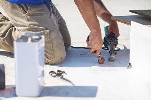 Mid-South Roof Systems team member working on roof Maintenance