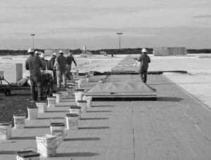Mid-South Roof Logos Team Members working atop a roof