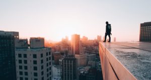 Man standing on the edge of a rooftop