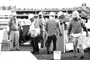Mid-South Roof Systems Team Members atop a roof working